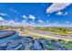 Scenic water feature with natural rock and lush landscaping, overlooking a golf course and neighborhood at 1950 Colvin Run Dr, Henderson, NV 89052