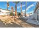 Lush backyard featuring mature landscaping, a brick planter, and a refreshing in-ground pool at 2606 Vegas Valley Dr, Las Vegas, NV 89121