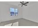 Bright bedroom with neutral walls, soft carpeting, and a window with exterior view at 2606 Vegas Valley Dr, Las Vegas, NV 89121