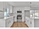 Modern kitchen featuring white cabinets, stainless steel appliances, and an island at 2606 Vegas Valley Dr, Las Vegas, NV 89121