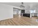 Bright living room featuring hardwood floors, modern light fixture, and eat in kitchen at 2606 Vegas Valley Dr, Las Vegas, NV 89121