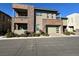 Modern two-story home features a balcony, desert landscaping, and a two car garage at 11280 Granite Ridge Dr # 1075, Las Vegas, NV 89135