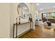 Modern foyer showcasing a glass console table, decorative accessories, and seamless transition to living spaces at 11280 Granite Ridge Dr # 1075, Las Vegas, NV 89135