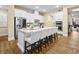 Well-lit kitchen featuring a center island with seating and stainless steel appliances at 11280 Granite Ridge Dr # 1075, Las Vegas, NV 89135