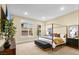 Main bedroom with a four-poster bed, neutral tones, and ample natural light at 11280 Granite Ridge Dr # 1075, Las Vegas, NV 89135