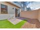 Private backyard with artificial turf and patio at 2667 Kindswood St, Henderson, NV 89044