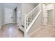 Light and bright entryway with hardwood floors and staircase at 2667 Kindswood St, Henderson, NV 89044