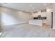 Open concept kitchen with white cabinets and island at 2667 Kindswood St, Henderson, NV 89044