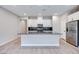 Modern kitchen with white cabinets, dark countertops, and island at 2667 Kindswood St, Henderson, NV 89044