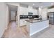 Modern kitchen with white cabinets, dark countertops and island at 2667 Kindswood St, Henderson, NV 89044