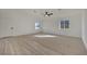 Large living area featuring light neutral color palette and wood-look flooring at 512 Purcell Dr, Las Vegas, NV 89107