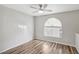 Bright bedroom with wood-look flooring and ceiling fan at 3125 N Buffalo Dr # 1133, Las Vegas, NV 89128