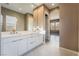 Elegant bathroom with double vanity and view of bedroom at 10232 Meandering Dell Ave, Las Vegas, NV 89166