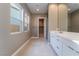 Modern bathroom with double vanity and walk-in shower at 10232 Meandering Dell Ave, Las Vegas, NV 89166