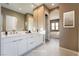 Double vanity bathroom with modern fixtures and neutral tones at 10232 Meandering Dell Ave, Las Vegas, NV 89166