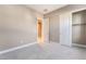 Bright bedroom with neutral walls and tile flooring at 10232 Meandering Dell Ave, Las Vegas, NV 89166