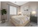 Guest bedroom with light wood furniture and neutral color palette at 10232 Meandering Dell Ave, Las Vegas, NV 89166