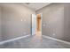 Well-lit bedroom with neutral walls and door to hallway at 10232 Meandering Dell Ave, Las Vegas, NV 89166