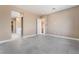 Spacious bedroom with tile floors and an ensuite bathroom at 10232 Meandering Dell Ave, Las Vegas, NV 89166