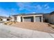 Single-story home with three-car garage and attractive landscaping at 10232 Meandering Dell Ave, Las Vegas, NV 89166