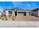 Modern three-car garage home with landscaped front yard at 10232 Meandering Dell Ave, Las Vegas, NV 89166