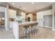 Modern kitchen features white cabinets, a large island, and stainless steel appliances at 10232 Meandering Dell Ave, Las Vegas, NV 89166