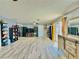 Expansive bedroom with light wood flooring and custom built-in shelving units at 1112 Sandy Cove St, Las Vegas, NV 89110