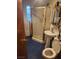 Bathroom with shower, toilet, and pedestal sink at 1708 Weeping Willow Ln, Las Vegas, NV 89104