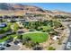 Neighborhood park with green lawns and modern homes nearby at 6411 Wild Blue Ct, Las Vegas, NV 89135