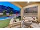 Inviting backyard oasis with pool and patio furniture at 6411 Wild Blue Ct, Las Vegas, NV 89135