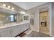 Elegant bathroom with double vanity, large mirror, and walk-in shower at 6411 Wild Blue Ct, Las Vegas, NV 89135