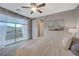 Main bedroom with private balcony and neutral decor at 6411 Wild Blue Ct, Las Vegas, NV 89135