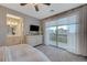 Bedroom with private balcony access and modern dresser at 6411 Wild Blue Ct, Las Vegas, NV 89135