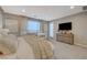 Main bedroom with large bed, dresser, and access to a private balcony at 6411 Wild Blue Ct, Las Vegas, NV 89135