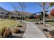 Walking path in a community park with picnic tables and barbeque grills at 6411 Wild Blue Ct, Las Vegas, NV 89135