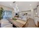 Open concept dining room with kitchen island and modern light fixture at 6411 Wild Blue Ct, Las Vegas, NV 89135