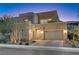 Modern two-story home with attached garage and manicured landscaping at 6411 Wild Blue Ct, Las Vegas, NV 89135