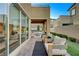 Relaxing patio with seating area and view of backyard at 6411 Wild Blue Ct, Las Vegas, NV 89135