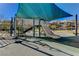 Modern shaded playground with climbing structures and slides at 6411 Wild Blue Ct, Las Vegas, NV 89135