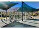 Modern shaded playground with climbing structures and slides at 6411 Wild Blue Ct, Las Vegas, NV 89135