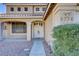 Front entry of two-story house with double doors at 8774 Libertyvale Dr, Las Vegas, NV 89123