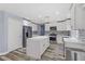 Modern kitchen featuring white cabinets and island at 8774 Libertyvale Dr, Las Vegas, NV 89123