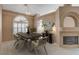 Elegant dining room with a wooden table and neutral color scheme at 2134 Eaglepath Cir, Henderson, NV 89074