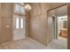 Entryway with a white door, arch window, and adjacent bathroom at 2134 Eaglepath Cir, Henderson, NV 89074