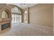 Spacious living room featuring a fireplace and high ceilings at 2134 Eaglepath Cir, Henderson, NV 89074