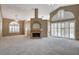 Living room with vaulted ceiling, fireplace and lots of natural light at 2134 Eaglepath Cir, Henderson, NV 89074