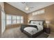 Relaxing main bedroom with large windows and ceiling fan at 2134 Eaglepath Cir, Henderson, NV 89074