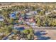 An aerial view showcasing a sprawling home with lush landscaping, surrounded by mature trees at 2868 Vista Del Sol Ave, Las Vegas, NV 89120