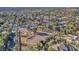 Expansive aerial shot of property, showcasing the horse arena, mature trees, and proximity to the city at 2868 Vista Del Sol Ave, Las Vegas, NV 89120