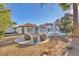 Expansive backyard featuring patio seating and a charming landscaped area, ideal for outdoor relaxation at 2868 Vista Del Sol Ave, Las Vegas, NV 89120